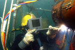 Underwater welding with surface clearing